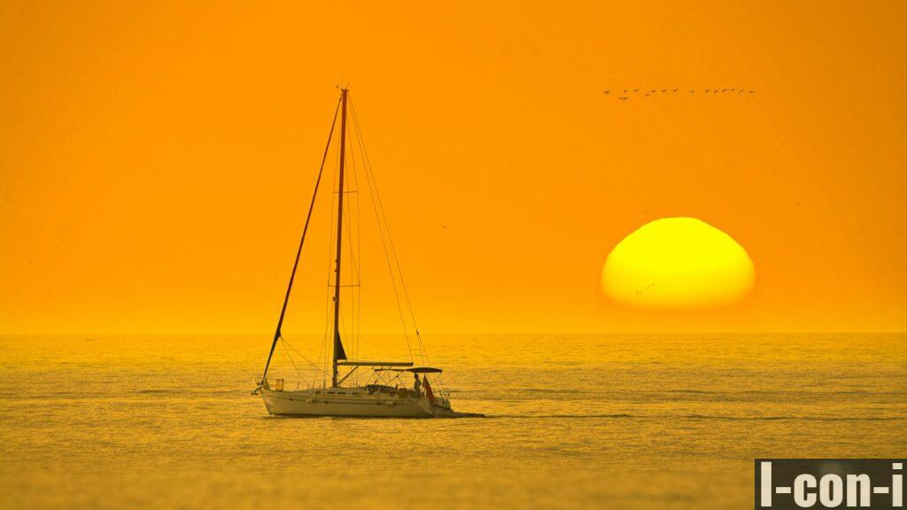 White Boat In The Middle Of The Sea During Sunset